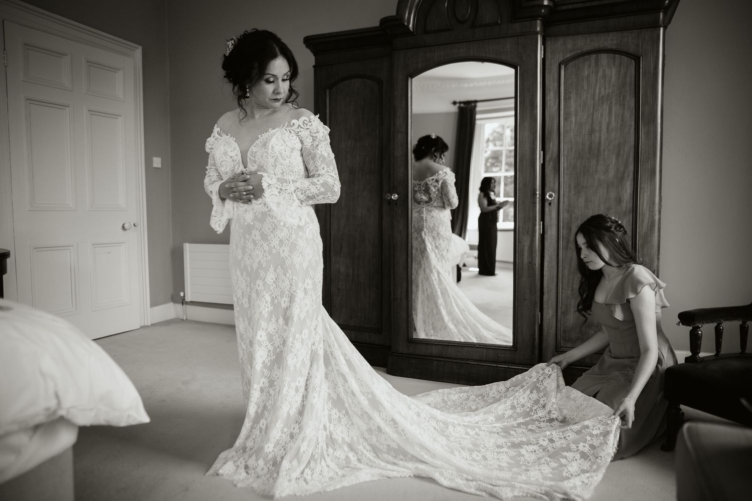 Wedding preparations showing multiple brides in white lace dresses getting ready in various rooms of an elegant venue.