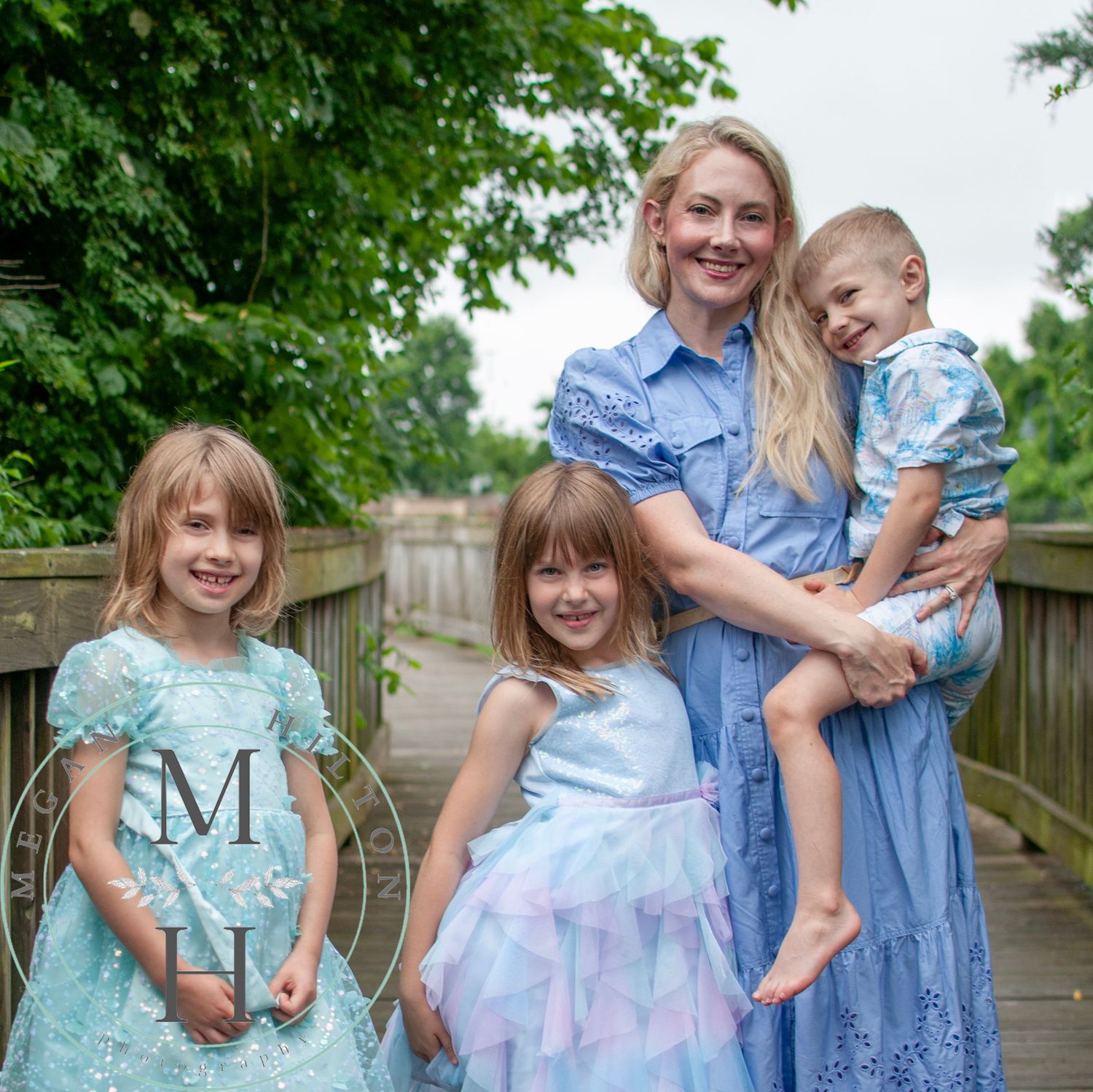 Photo of a family of 4 walking along a wooden footpath in Broadlands, VA,