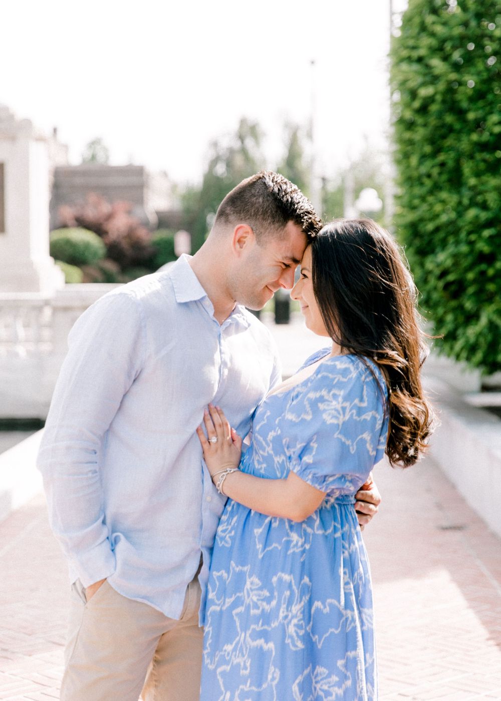 Romantic engagement photo of couple in the courtyard of Jockey Hollow Bar & Kitchen in Morristown, NJ.