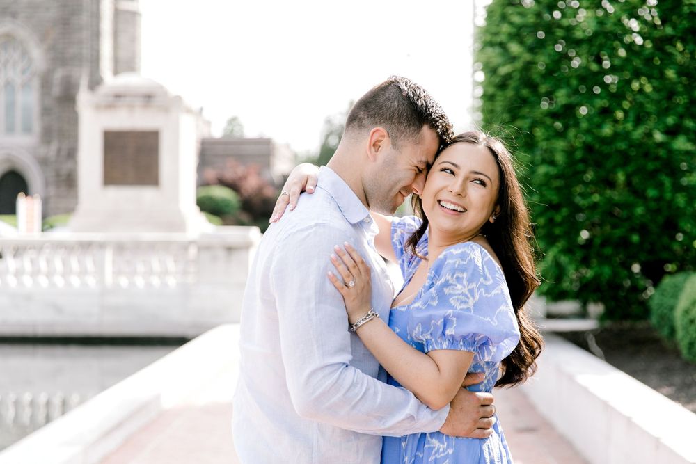 Romantic engagement photo of couple in the courtyard of Jockey Hollow Bar & Kitchen in Morristown, NJ.