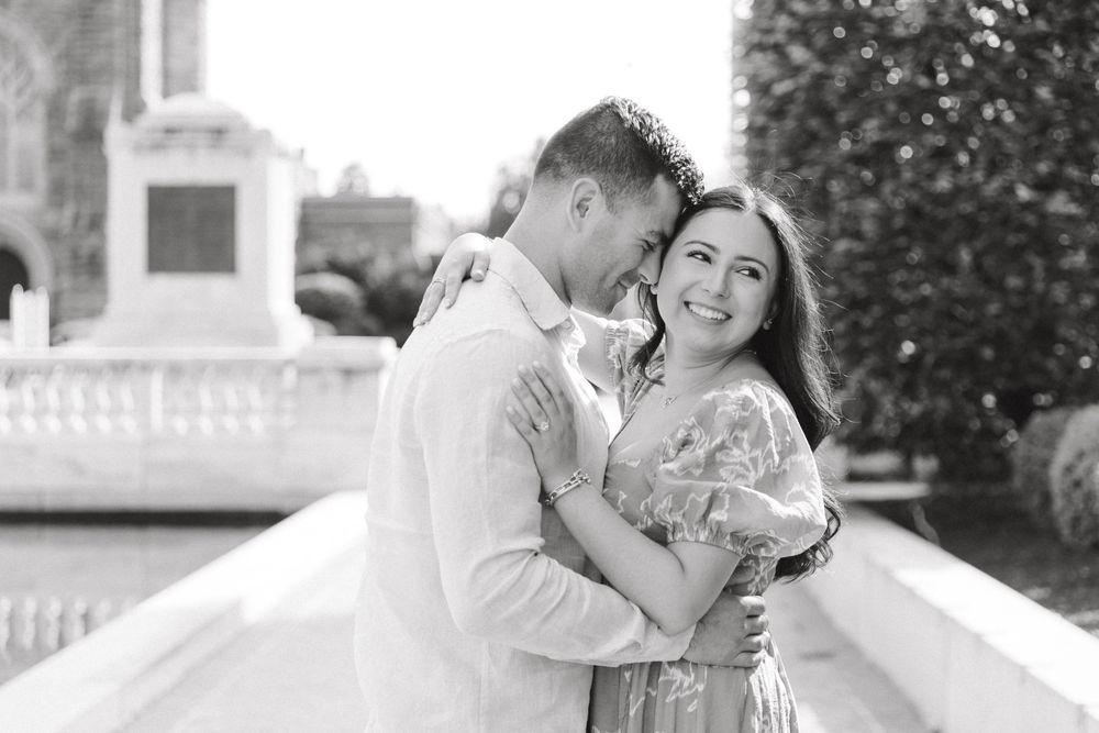 Romantic engagement photo of couple in the courtyard of Jockey Hollow Bar & Kitchen in Morristown, NJ.