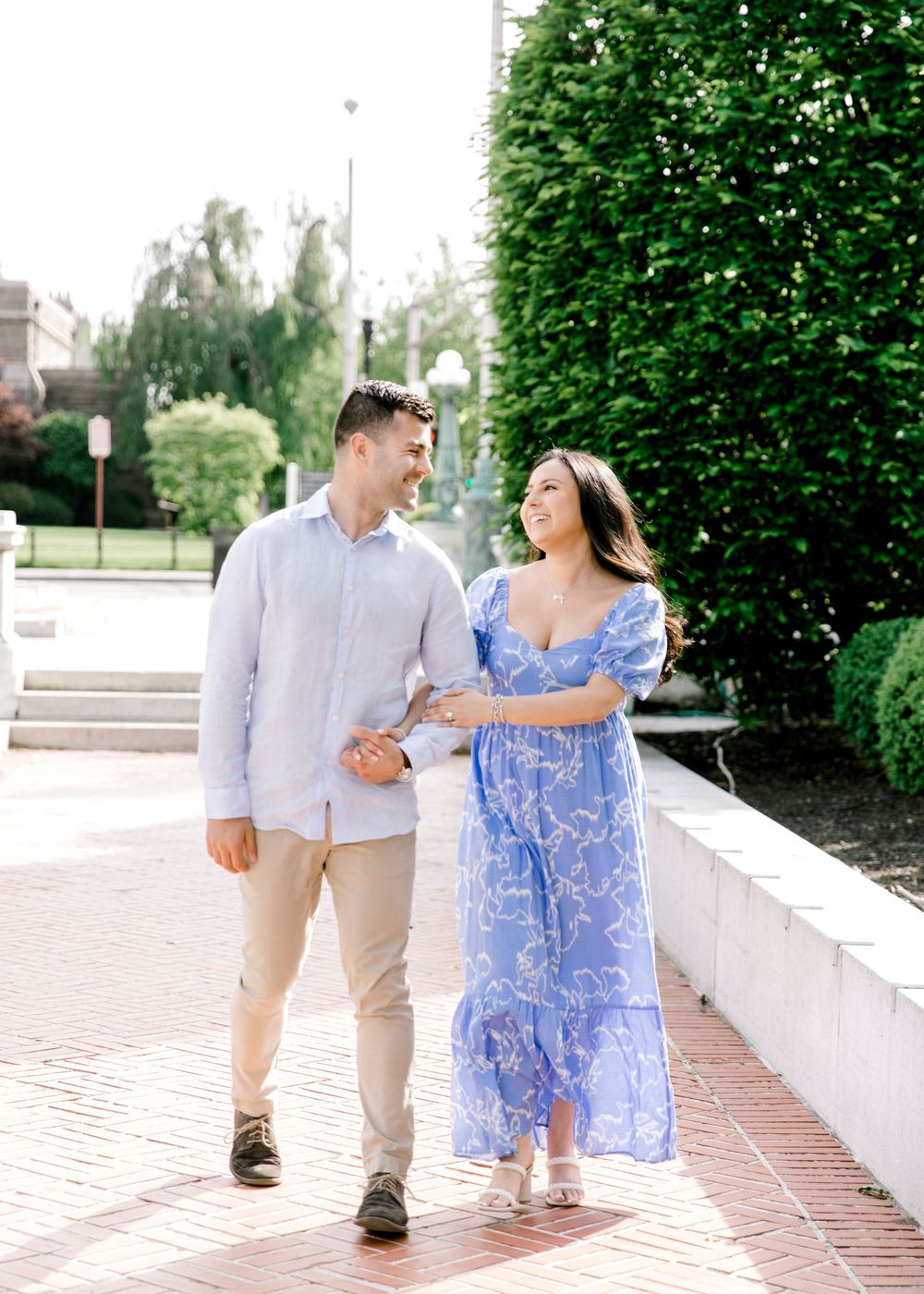 Romantic engagement photo of couple in the courtyard of Jockey Hollow Bar & Kitchen in Morristown, NJ.