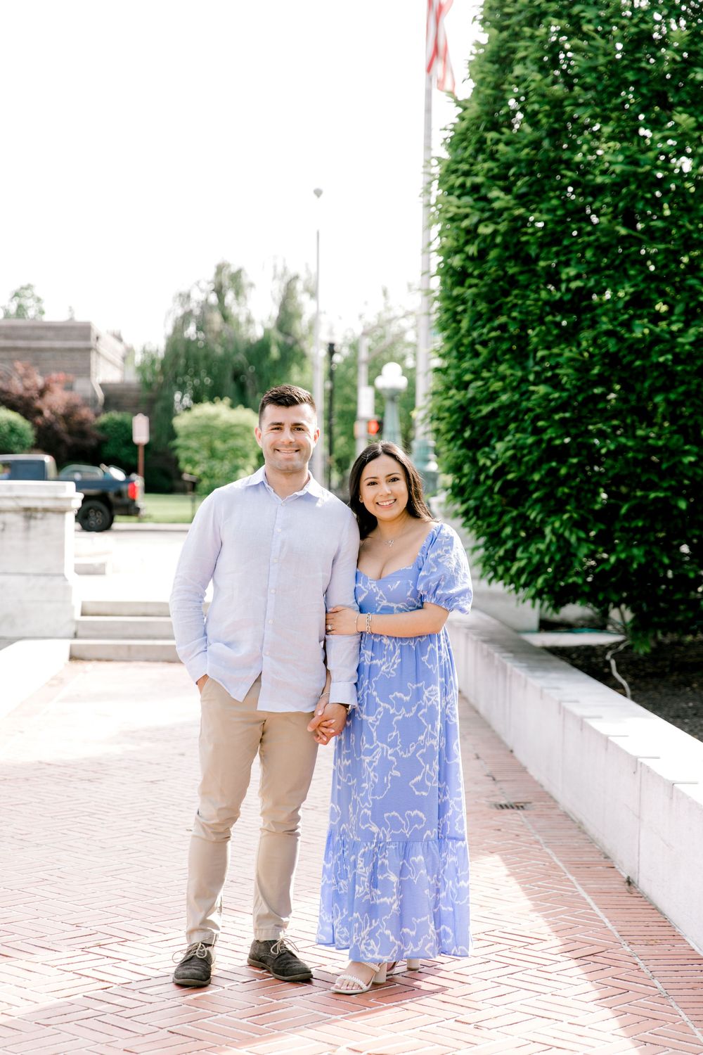 Romantic engagement photo of couple in the courtyard of Jockey Hollow Bar & Kitchen in Morristown, NJ.