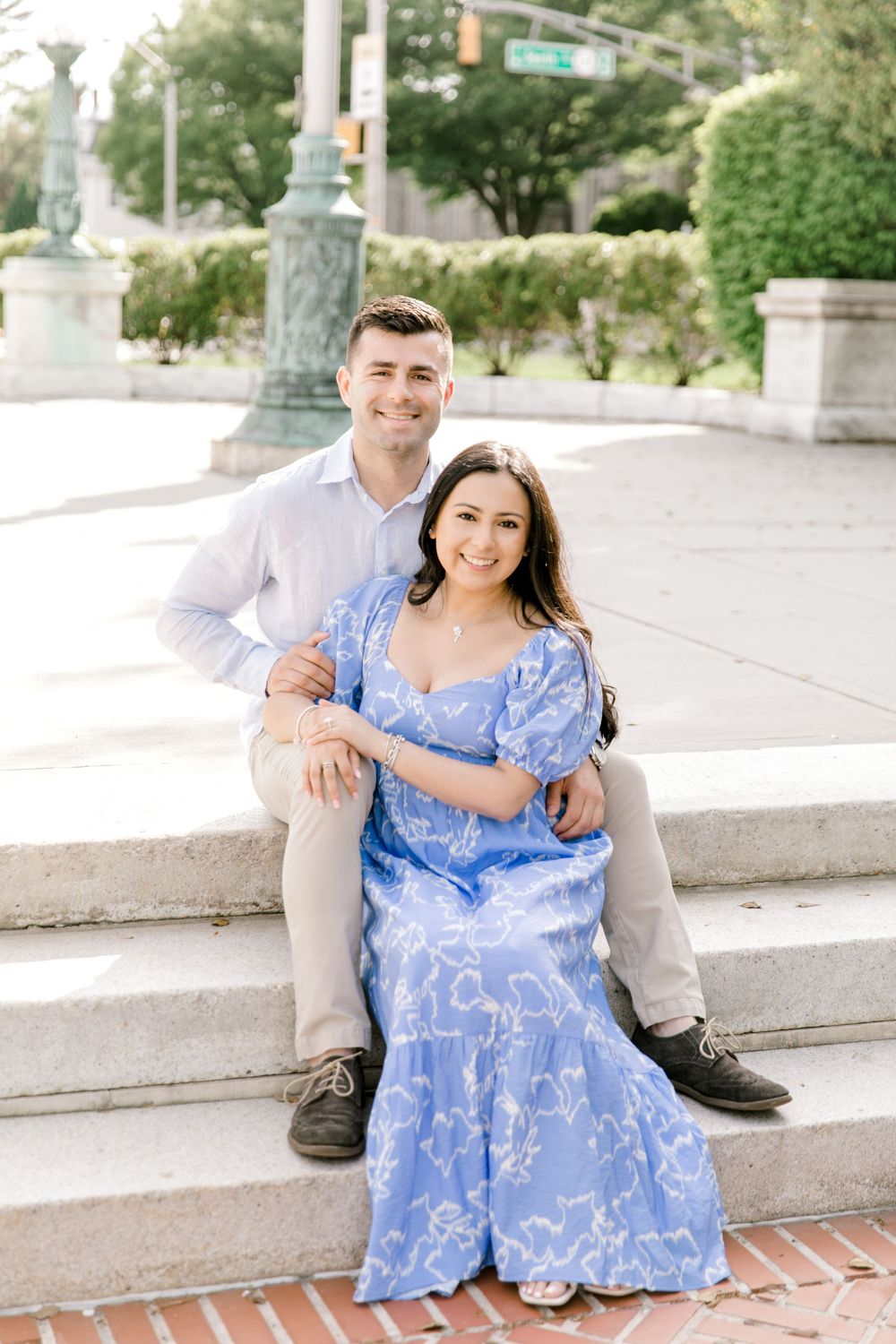 Romantic engagement photo of couple in the courtyard of Jockey Hollow Bar & Kitchen in Morristown, NJ.