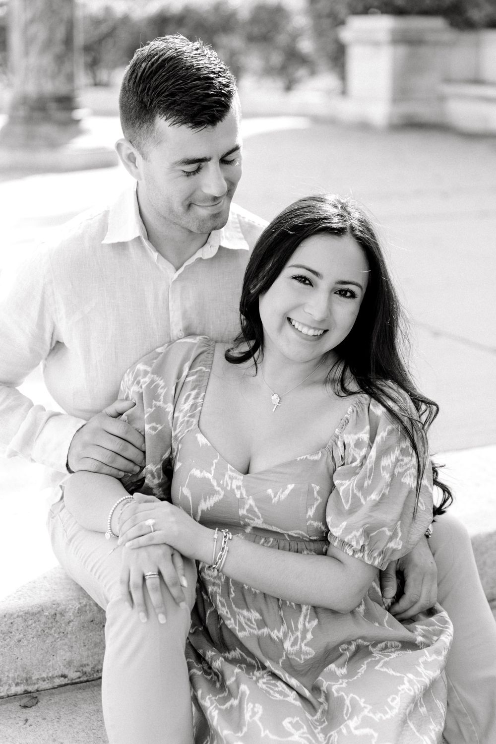 Romantic engagement photo of couple in the courtyard of Jockey Hollow Bar & Kitchen in Morristown, NJ.