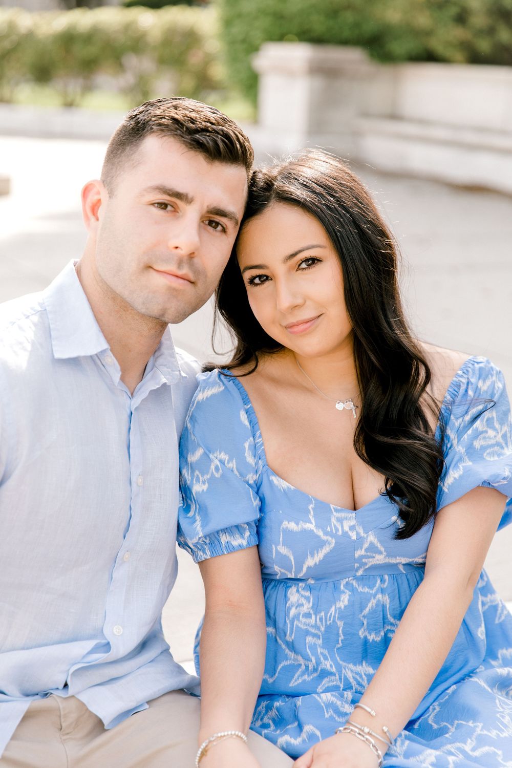 Romantic engagement photo of couple in the courtyard of Jockey Hollow Bar & Kitchen in Morristown, NJ.