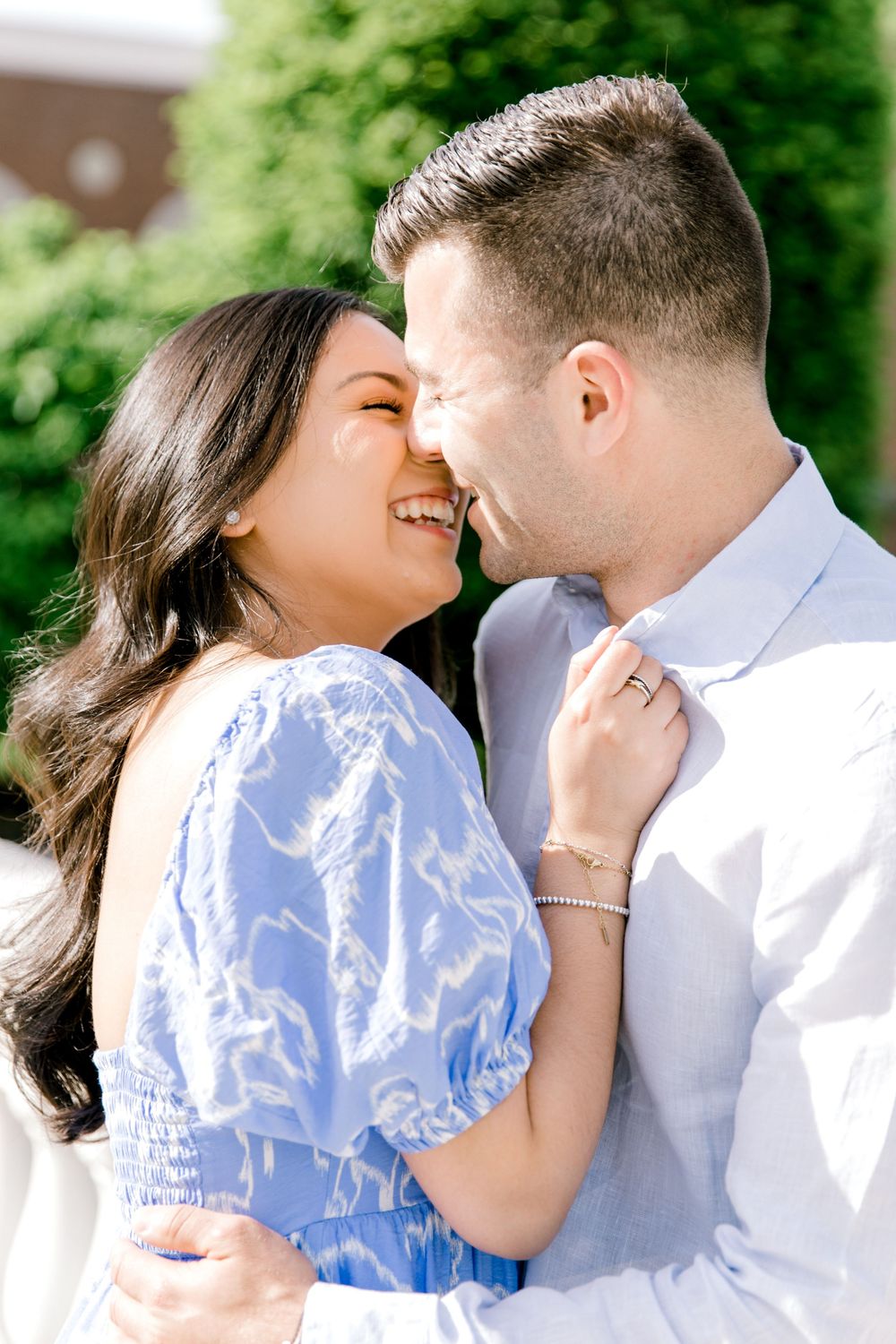 Romantic engagement photo of couple in the courtyard of Jockey Hollow Bar & Kitchen in Morristown, NJ.