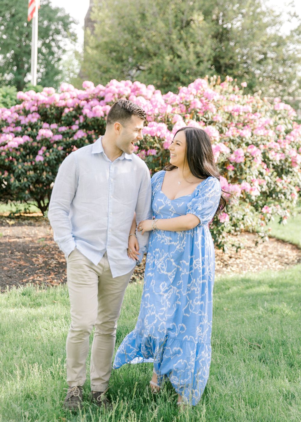 Romantic engagement photo of couple in the courtyard of Jockey Hollow Bar & Kitchen in Morristown, NJ.
