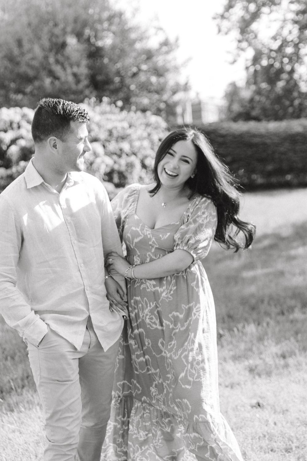 Romantic engagement photo of couple in the courtyard of Jockey Hollow Bar & Kitchen in Morristown, NJ.