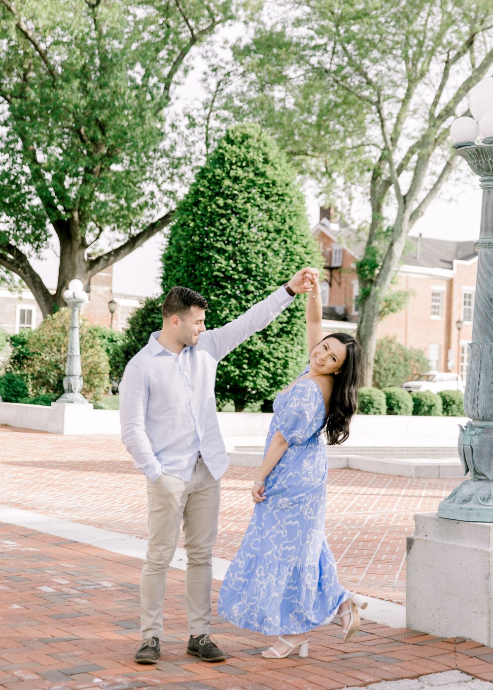 Romantic engagement photo of couple in the courtyard of Jockey Hollow Bar & Kitchen in Morristown, NJ.