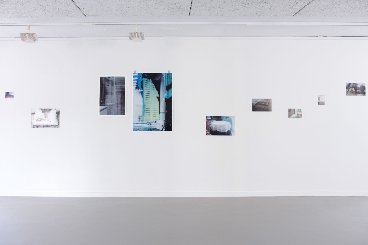 Various photographic prints pinned to walls at Hå gamle prestegard, Sept–Nov 2022 show by Dan Skjæveland.