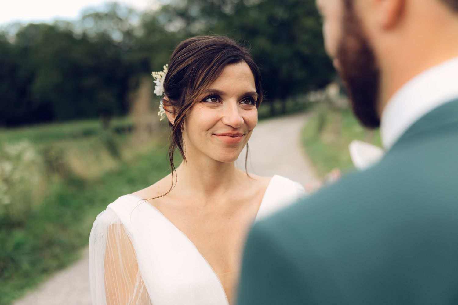 A beautiful outdoor wedding portrait capturing an intimate moment between newlyweds.