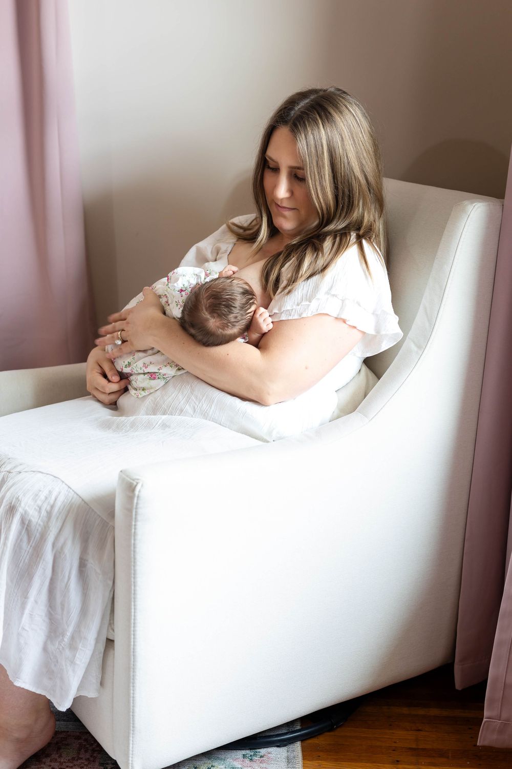 Series of intimate portraits taken on a white chaise lounge against pink walls.
