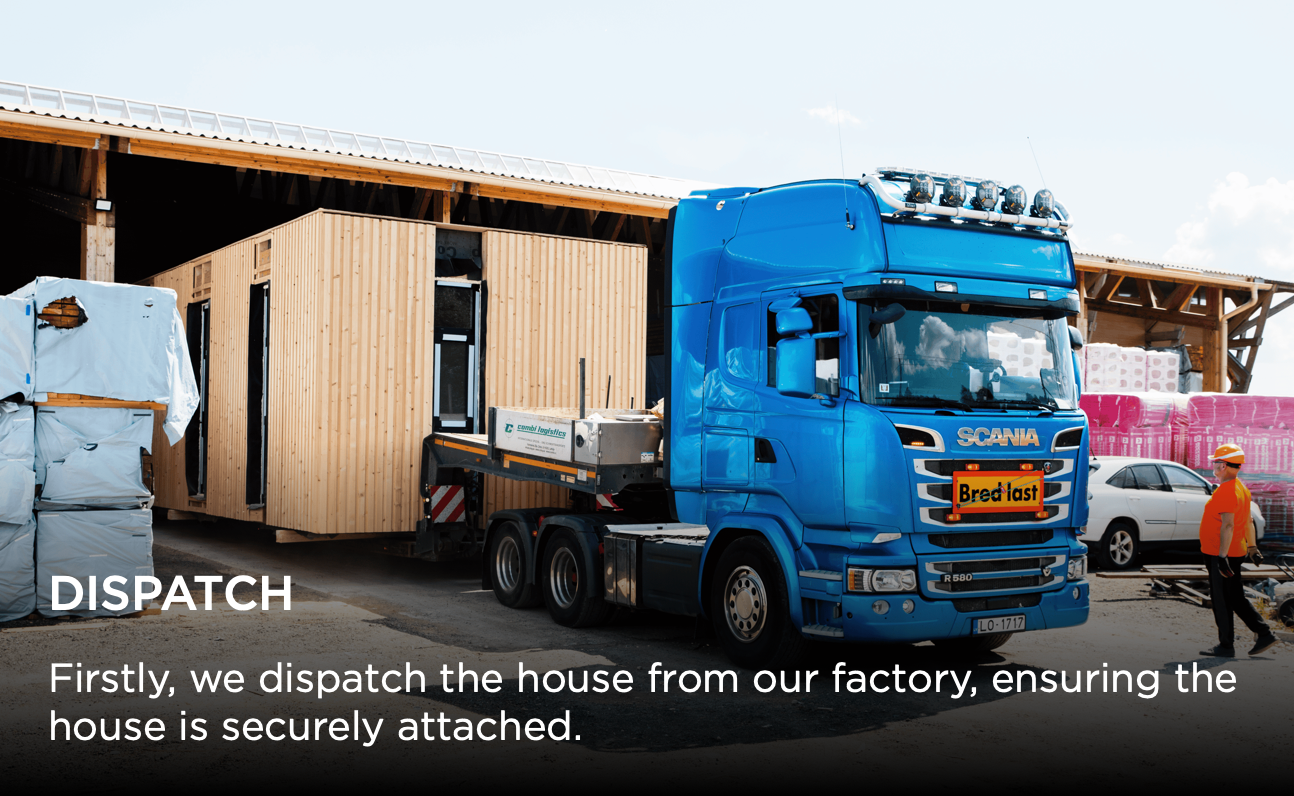 A bright blue Scania truck with cargo preparing for dispatch at a warehouse loading dock area.
