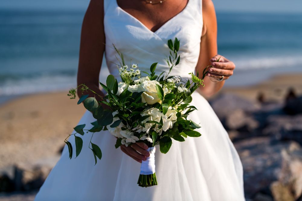 Elegant beach wedding photography collage showing closeups of white bridal bouquets and flowing dress details against ocean backdrop.