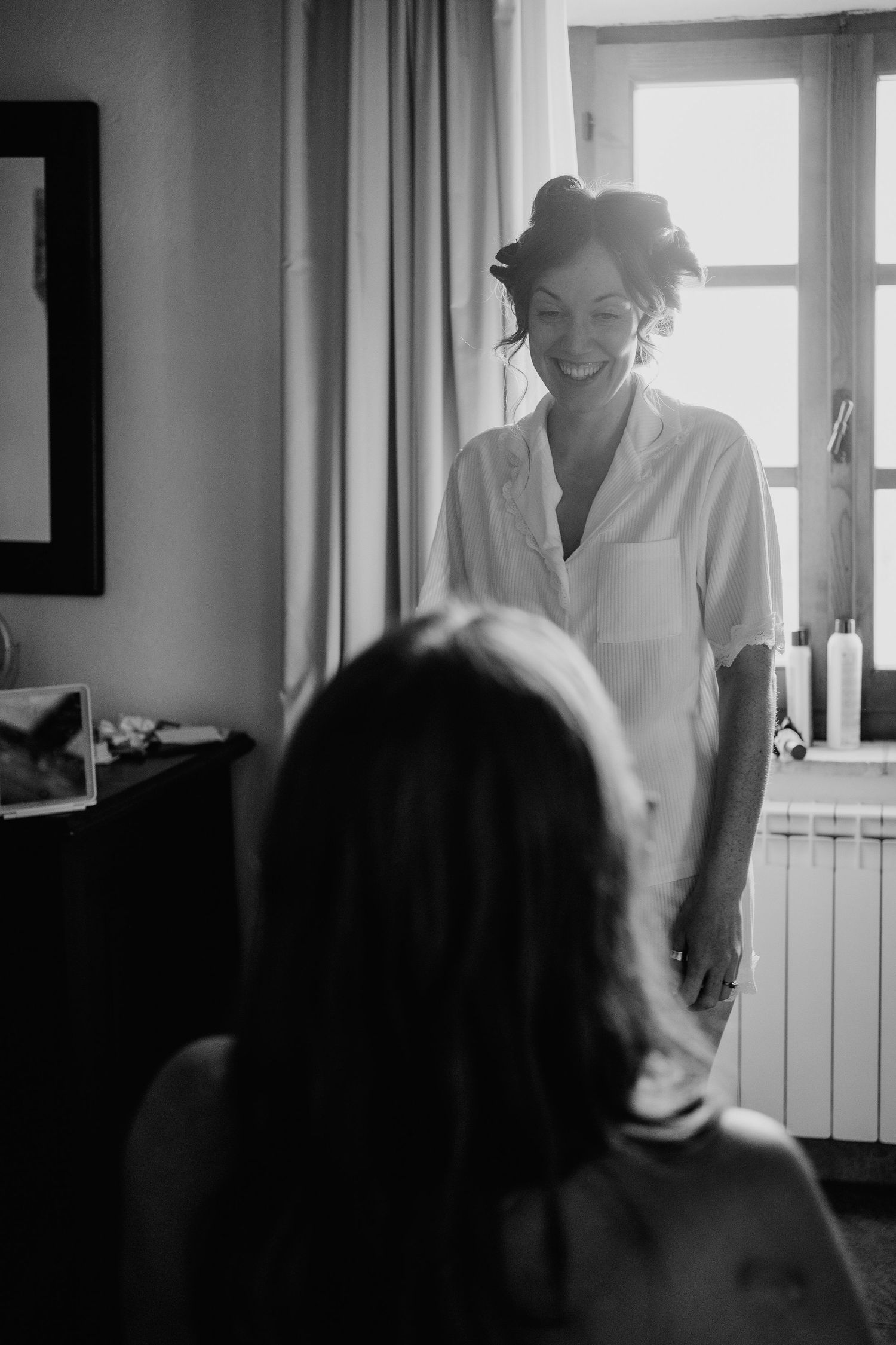 Black and white of bride laughing at Italian wedding