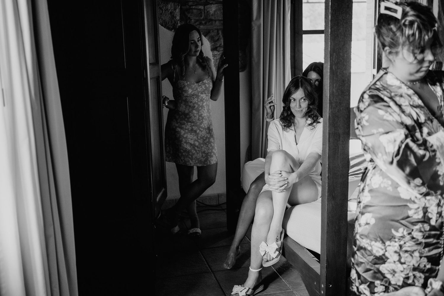 Editorial wedding photography of bride getting ready in black and white