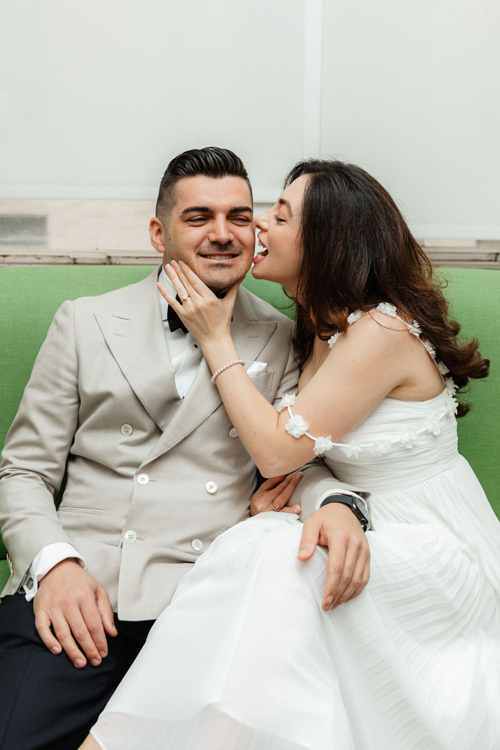 A couple in wedding attire share intimate moments in a series of sweet outdoor portrait photos.
