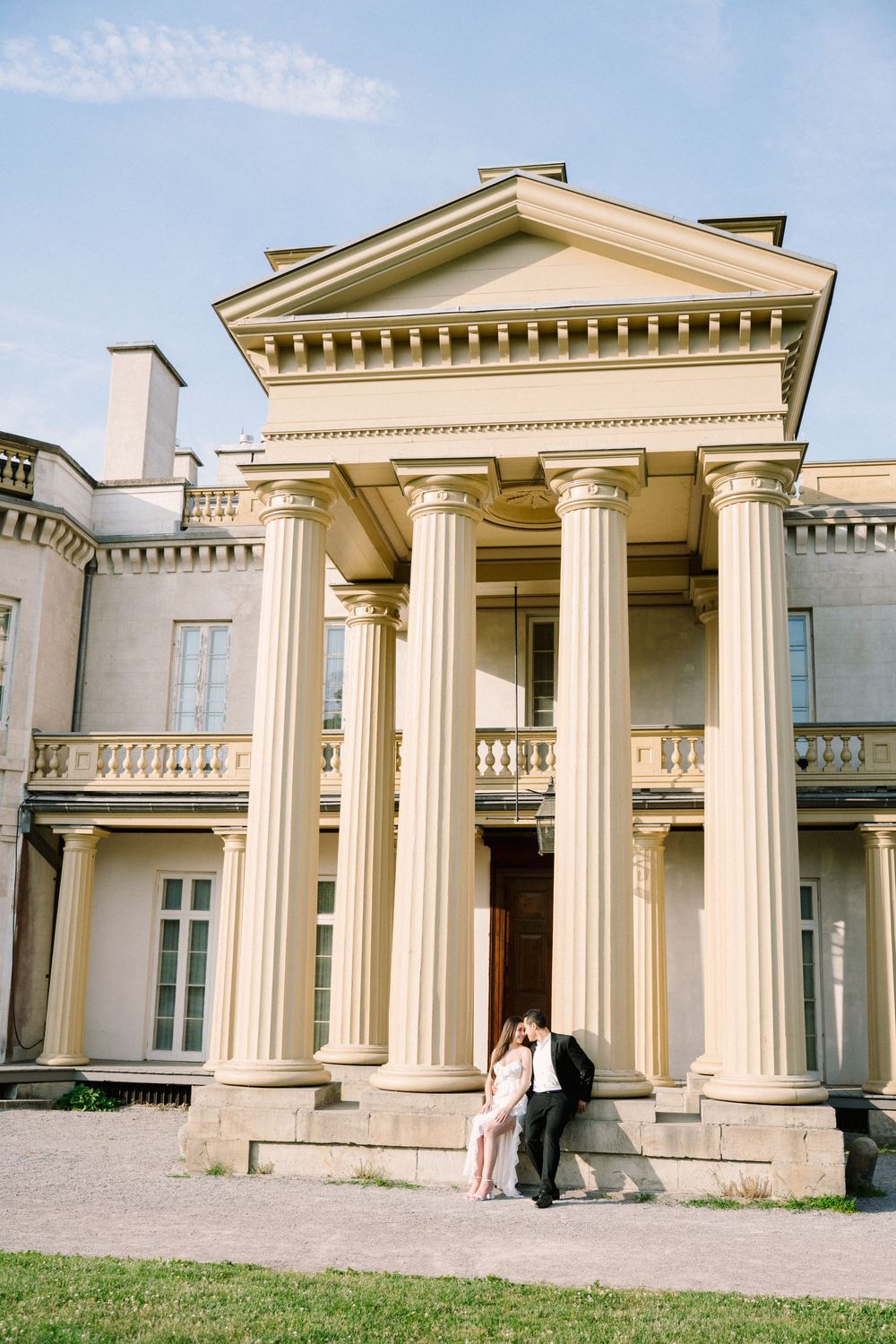 Exterior photos of a grand neoclassical mansion with tall white columns and triangular pediment across multiple angles.