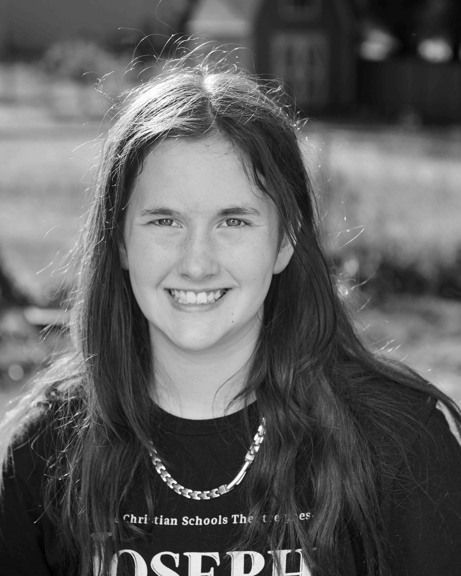 black and white headshot of junior high girl outside in natural light using Omega Reflector by Jerry Ghionis.