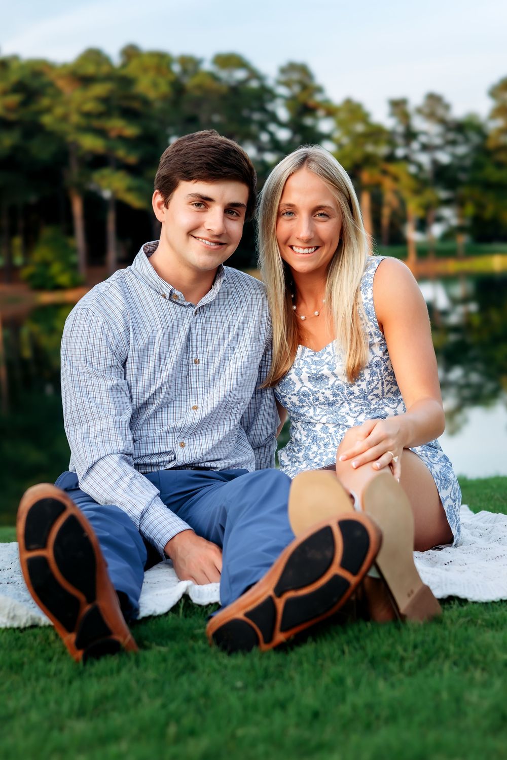 Newly engaged couple posing by lake after saying yes at Athens Country Club — photographed by Ansley Howe Photography