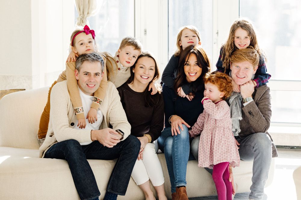 Family portrait of the Hanrahan family, captured outdoors during a joyful moment together