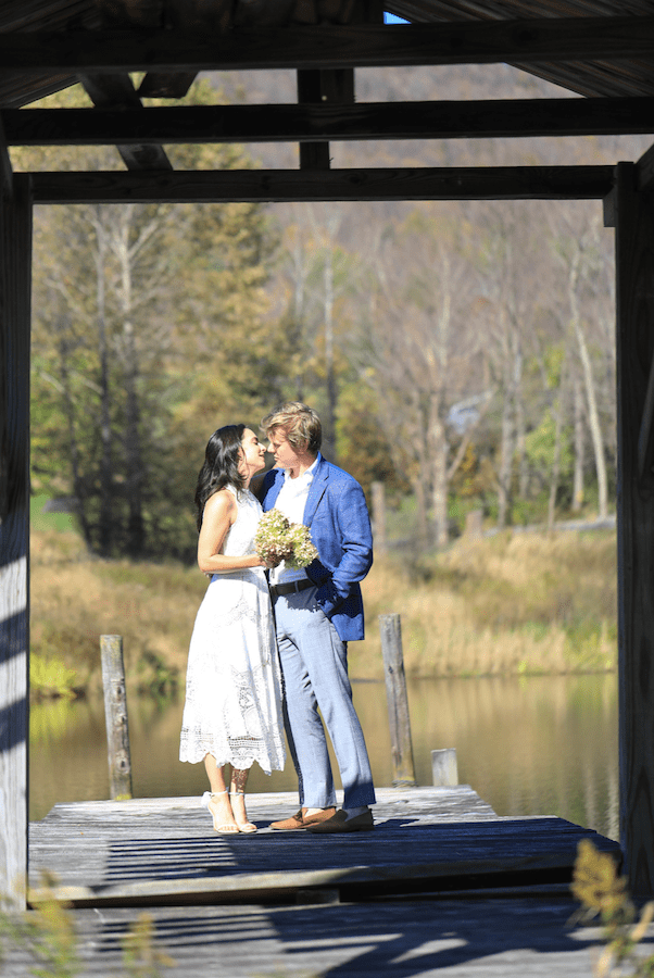 Catskills mountain elopement couple in wedding attire in a fall scenery