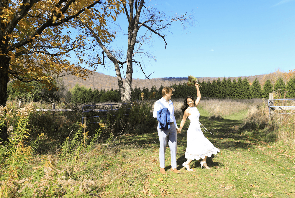 Catskills mountain elopement couple in wedding attire in a fall scenery