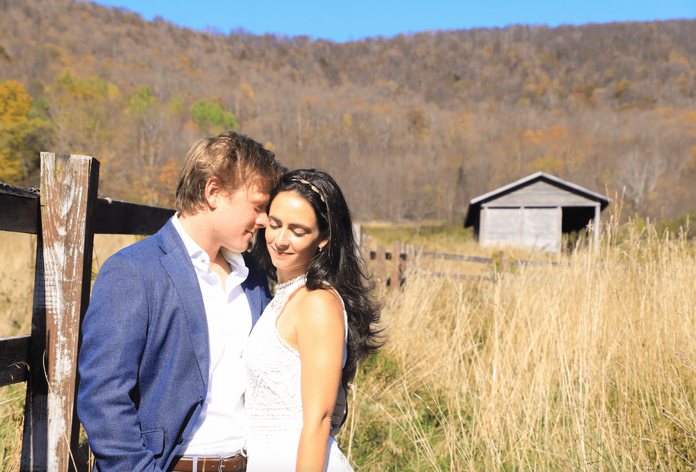 Catskills mountain elopement couple in wedding attire in a fall scenery
