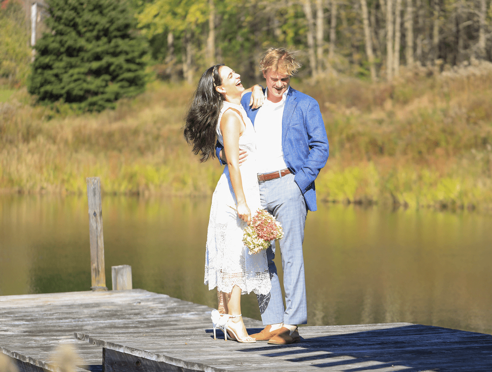 Catskills mountain elopement couple in wedding attire in a fall scenery