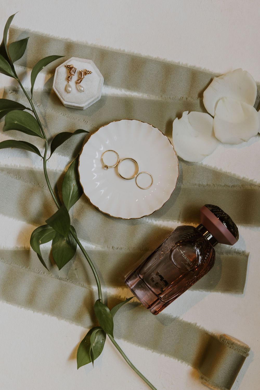 Bridal detail flat lay at wedding in Fort Pierce, Florida at The Lake House venue captured by Lindsay McDow Photography.