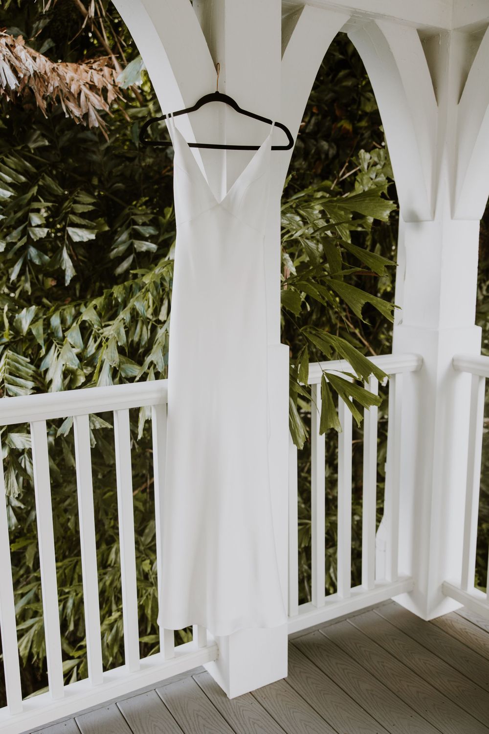 Bride's dress detail photos at wedding in Fort Pierce, Florida at The Lake House venue captured by Lindsay McDow Photography. Vowd Weddings
