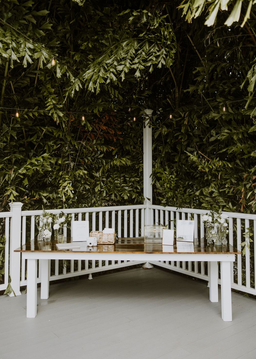 Cocktail hour details at wedding in Fort Pierce, Florida at The Lake House venue captured by Lindsay McDow Photography. Greenery, candles