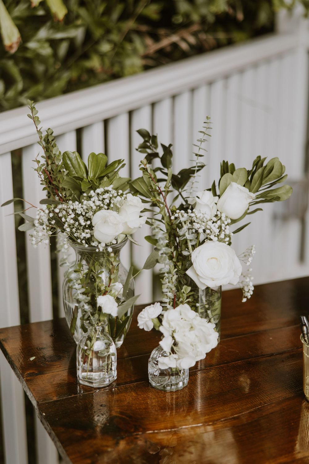 Cocktail hour details at wedding in Fort Pierce, Florida at The Lake House venue captured by Lindsay McDow Photography. Greenery, candles