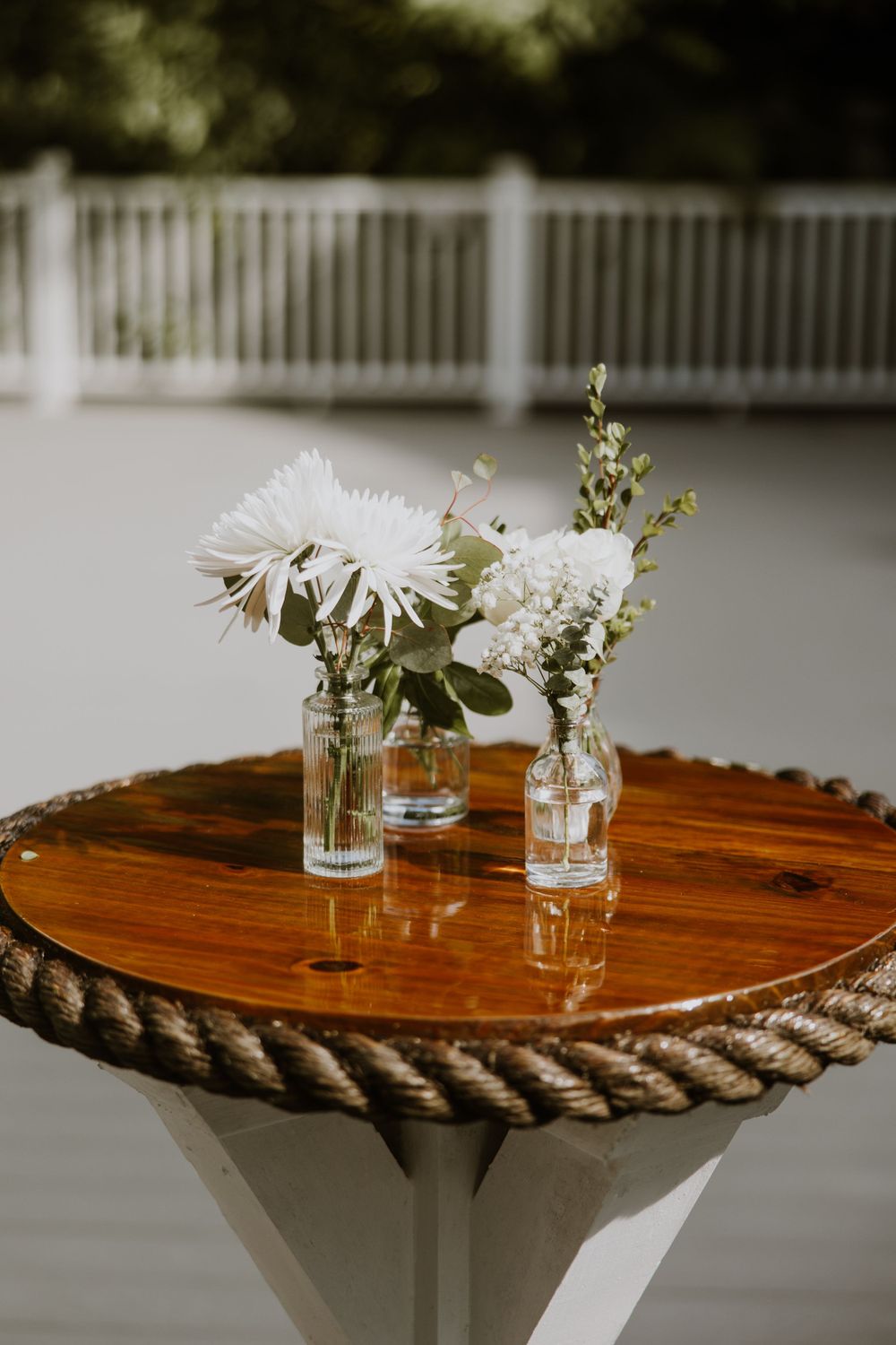 Cocktail hour details at wedding in Fort Pierce, Florida at The Lake House venue captured by Lindsay McDow Photography. Greenery, candles