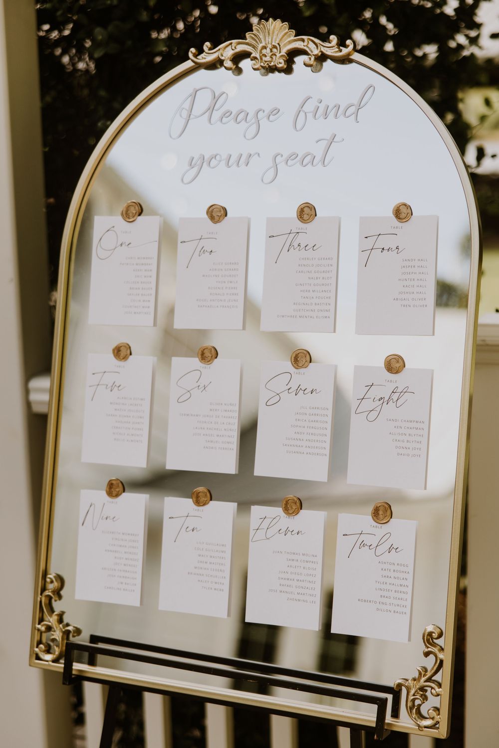 Cocktail hour details at wedding in Fort Pierce, Florida at The Lake House venue captured by Lindsay McDow Photography. Greenery, candles