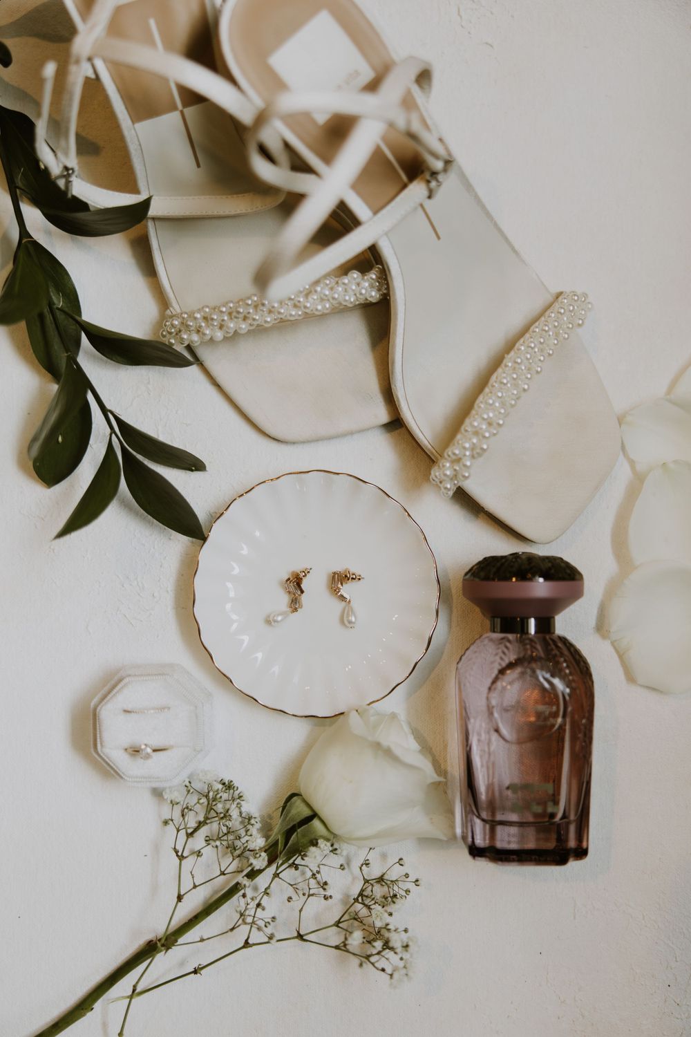 Bridal detail flat lay at wedding in Fort Pierce, Florida at The Lake House venue captured by Lindsay McDow Photography.