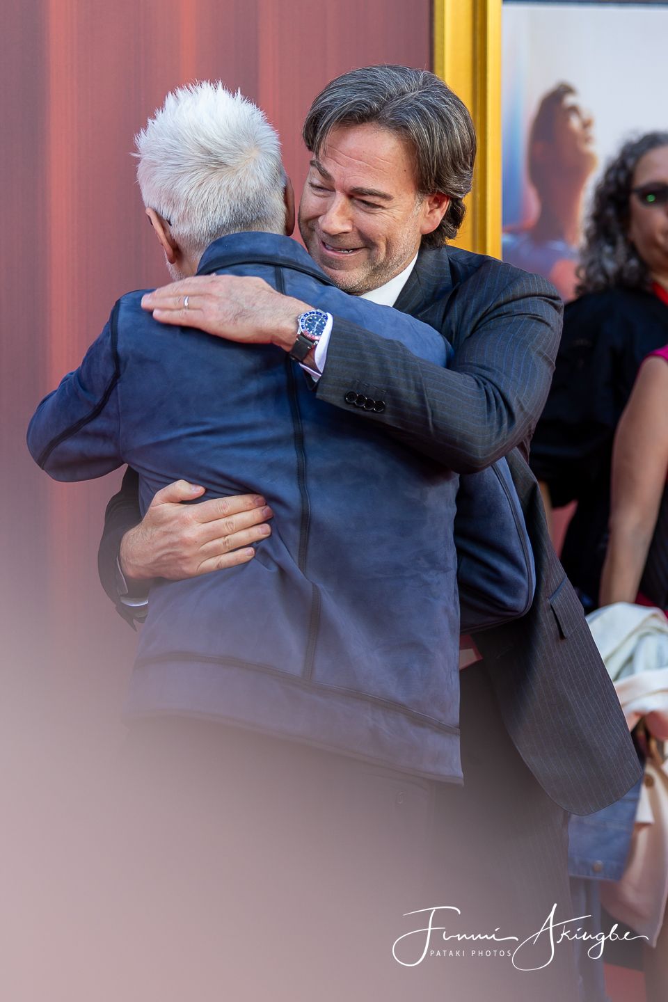 Director James Gunn and Producer Peter Safran sharing a moment at the UK Fan Event for the 2025 movie at Leicester Square, London