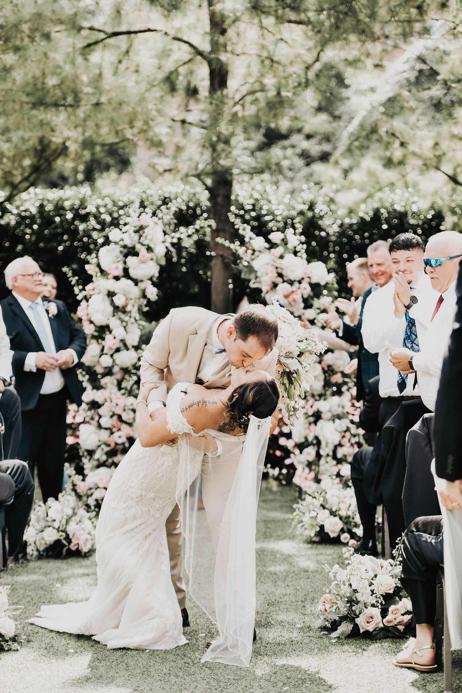 First kiss as husband and wife in the courtyard of Hotel Drover
