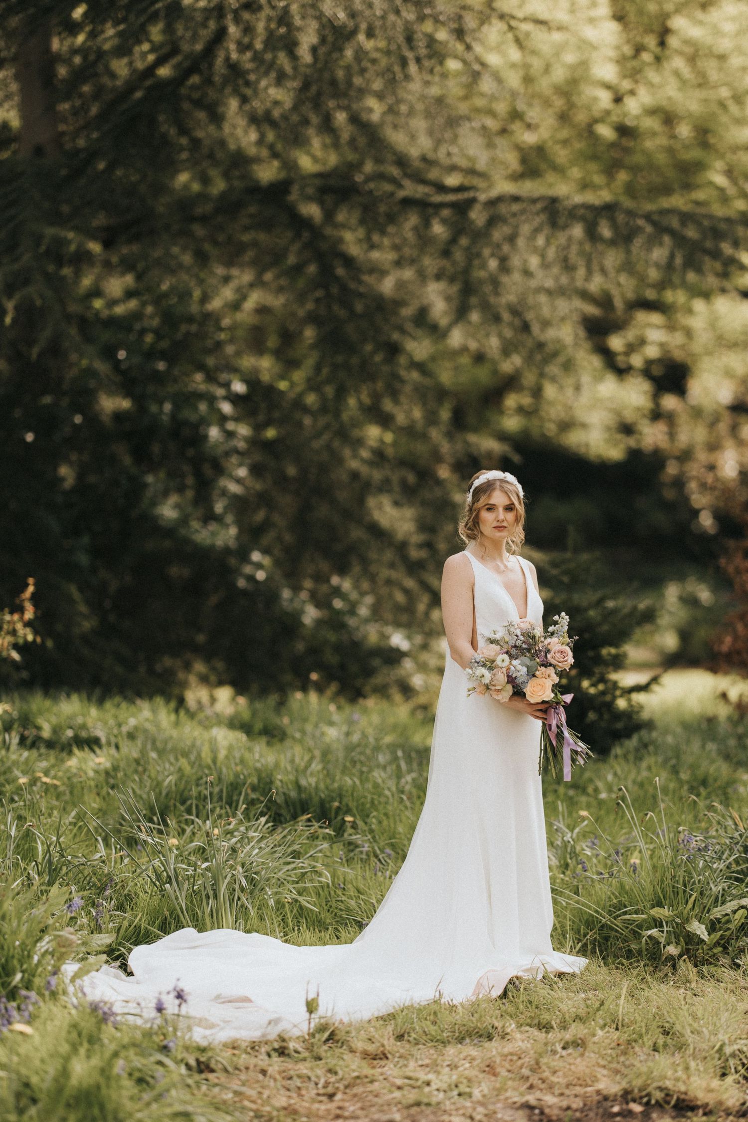 A bridal portrait session featuring full-length shots in a natural outdoor setting with tall grass and trees.