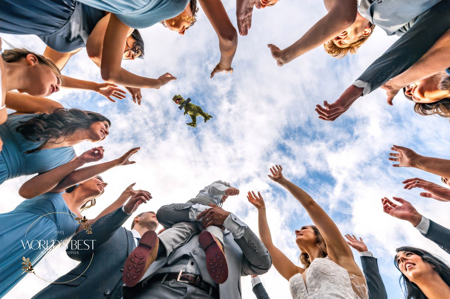 Low angle shot of guests forming a circle against blue sky at an outdoor celebration.