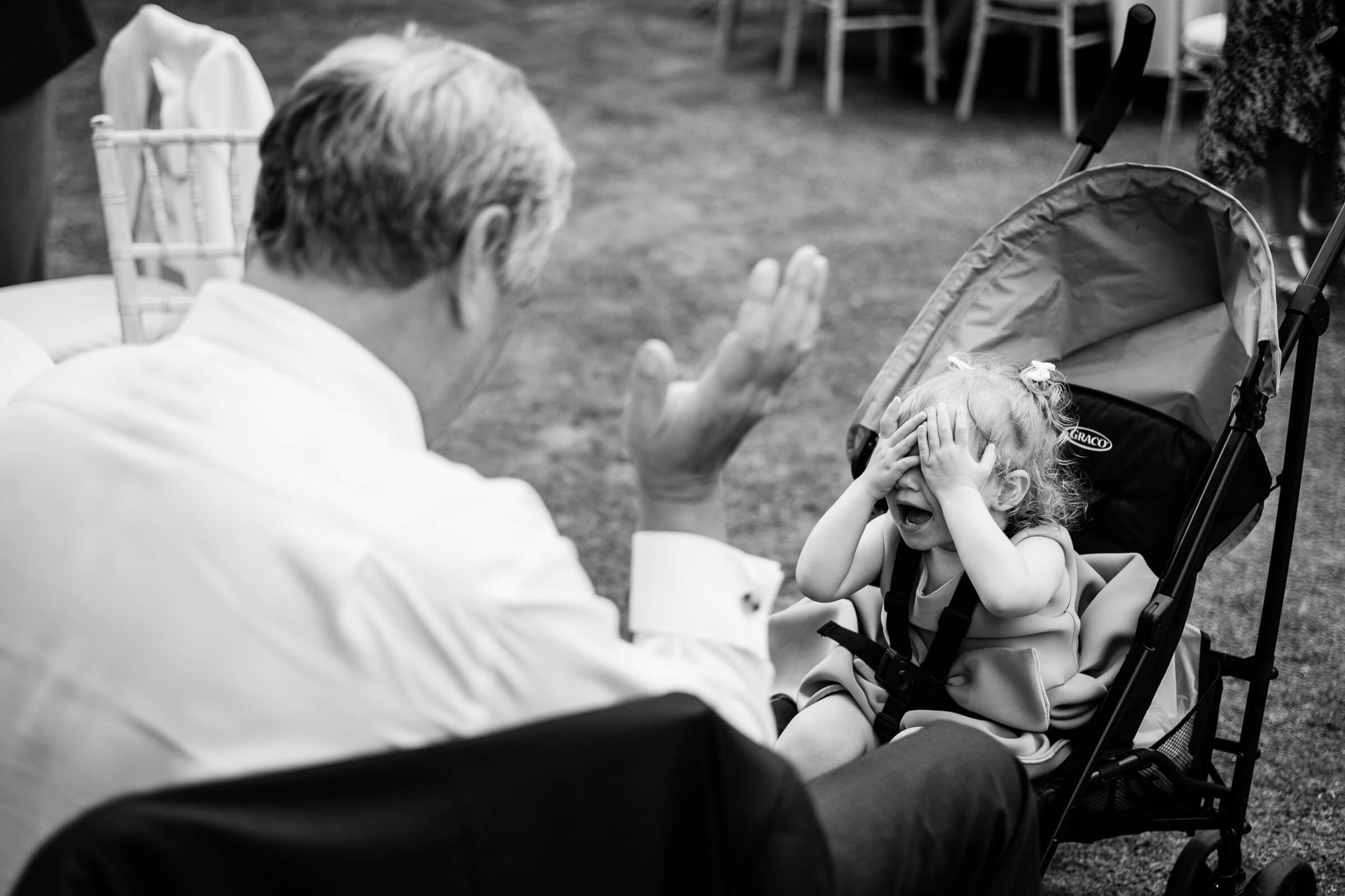 black and white wedding phot of grandad and child