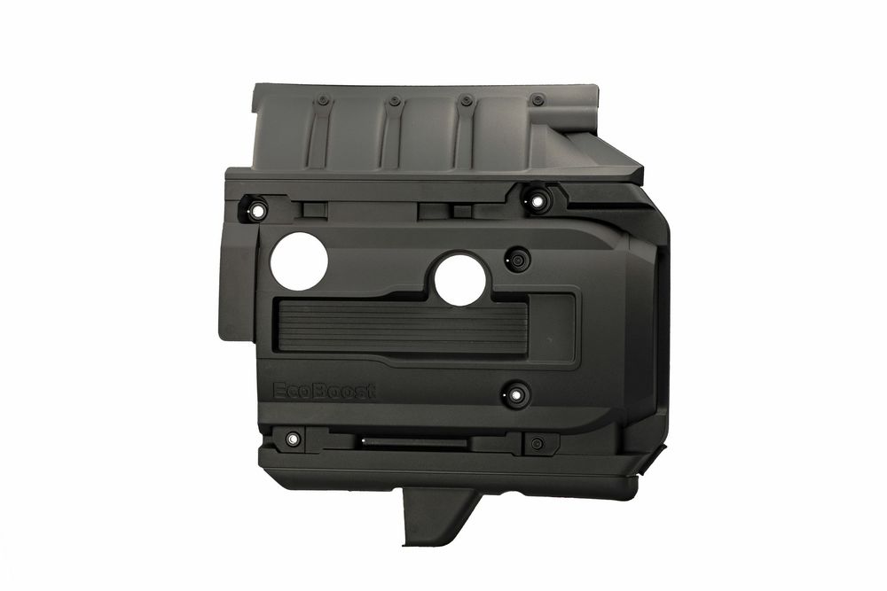Black plastic protective engine cover with mounting holes and textured surface design for automotive use.