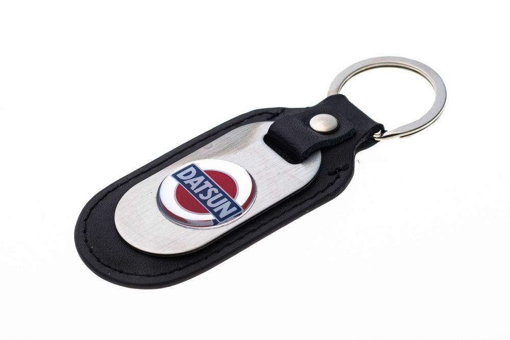A black leather keychain with the NHRA racing logo on a white oval center piece.
