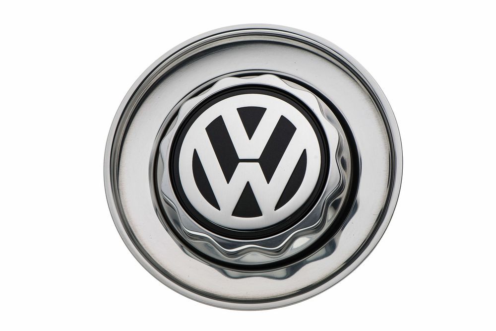 Chrome Volkswagen VW center cap with black logo on metallic silver alloy wheel hub.