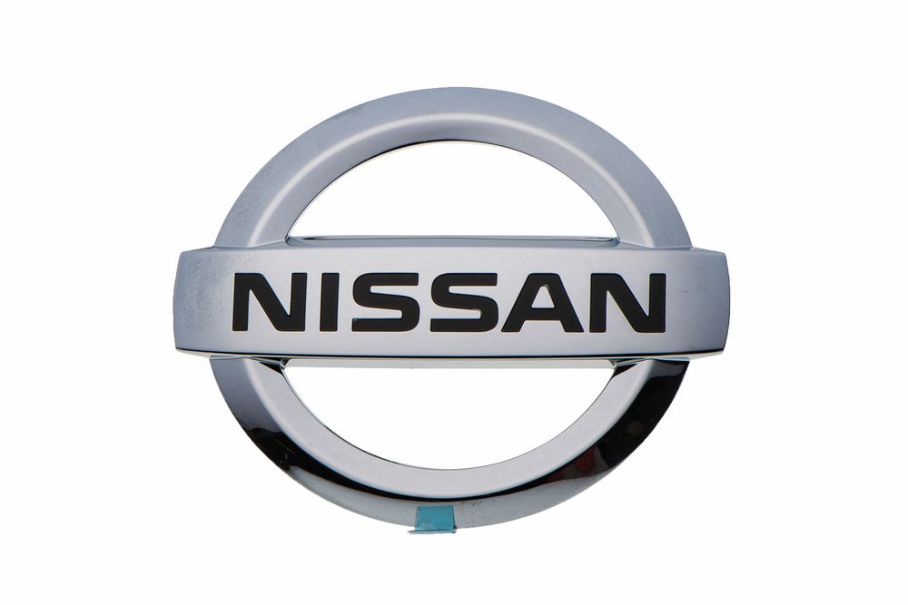 The silver Nissan automotive logo featuring the company name within a circular metallic badge design.