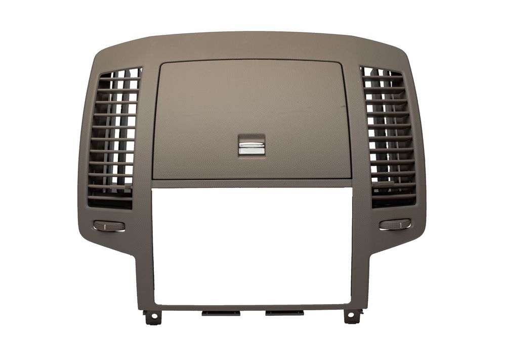 A beige plastic car dashboard center console panel with air vents and display frame for a Cadillac CTS model.