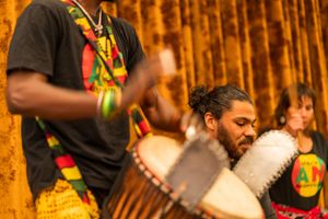 Musicians playing traditional drums during a cultural performance.