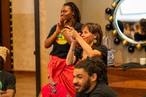 Audience members engaging enthusiastically during interactive performance segment.