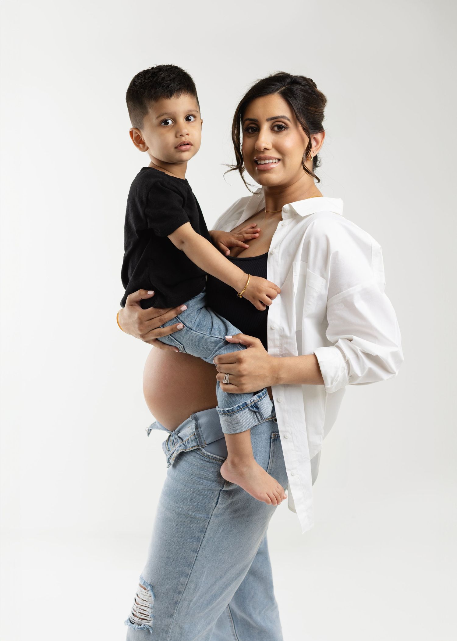 Gorgeous Rumneet awaits her new baby's arrival. Cloverdale. Surrey. Maternity Photography bump photos. Sleek black dress with cutout.